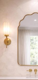 Handmade brass bathroom mirror with cloud arch top and slim brass frame