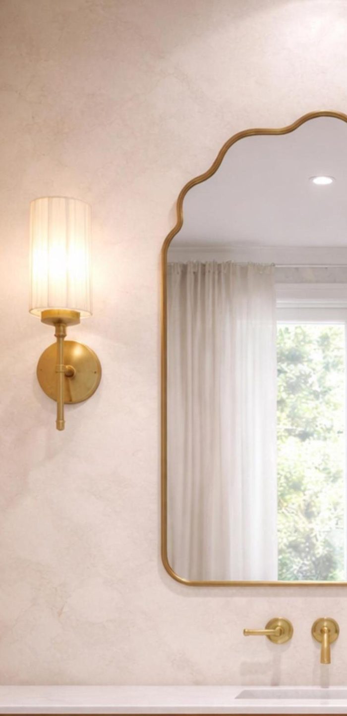 Handmade brass bathroom mirror with cloud arch top and slim brass frame