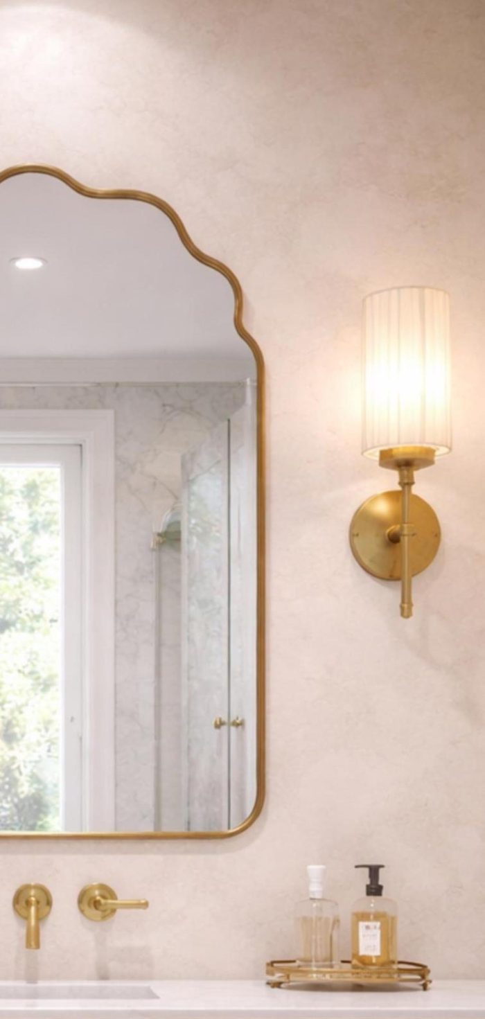 Handmade brass bathroom mirror with cloud arch top and slim brass frame