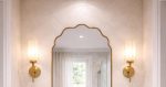 Handmade brass bathroom mirror with cloud arch top and slim brass frame