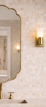 Handmade Moroccan Scalloped Brass Mirror with decorative floral shape above bathroom vanity