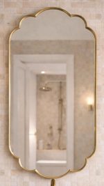 Handmade Moroccan Scalloped Brass Mirror with decorative floral shape above bathroom vanity