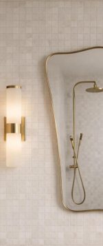 Curved Rectangle Brass Mirror with handcrafted slim brass frame in a modern bathroom vanity setting