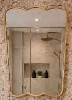 Triple Curve Brass Mirror with sculpted edges and slim handcrafted brass frame