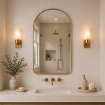 Arched Brass Bathroom Mirror with slim brass frame above modern bathroom vanity