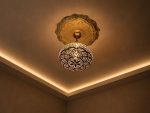 Globe Moroccan Brass Pendant Light casting decorative patterned shadows across ceiling