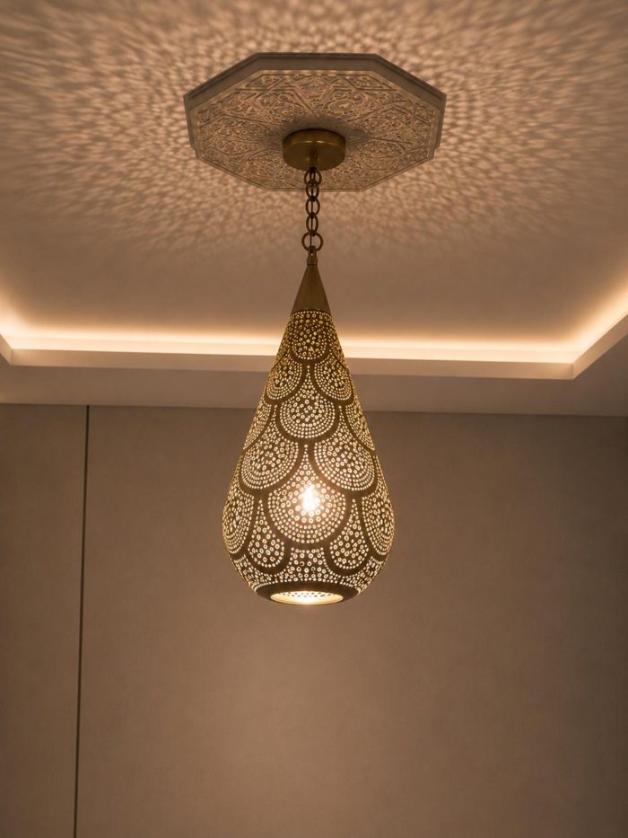 Teardrop Moroccan Brass Pendant Light handmade pierced brass hanging lamp casting decorative ceiling shadows