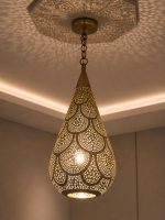 Teardrop Moroccan Brass Pendant Light handmade pierced brass hanging lamp casting decorative ceiling shadows