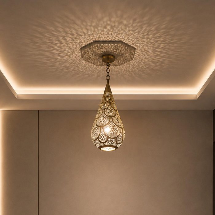 Teardrop Moroccan Brass Pendant Light handmade pierced brass hanging lamp casting decorative ceiling shadows