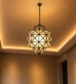 Geometric Glass Pendant Light with faceted glass panels and handcrafted metal frame