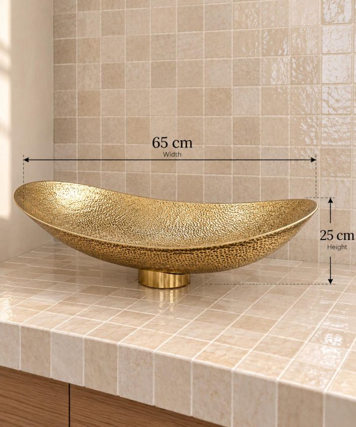Hand hammered brass vessel sink with elongated oval shape and textured golden finish